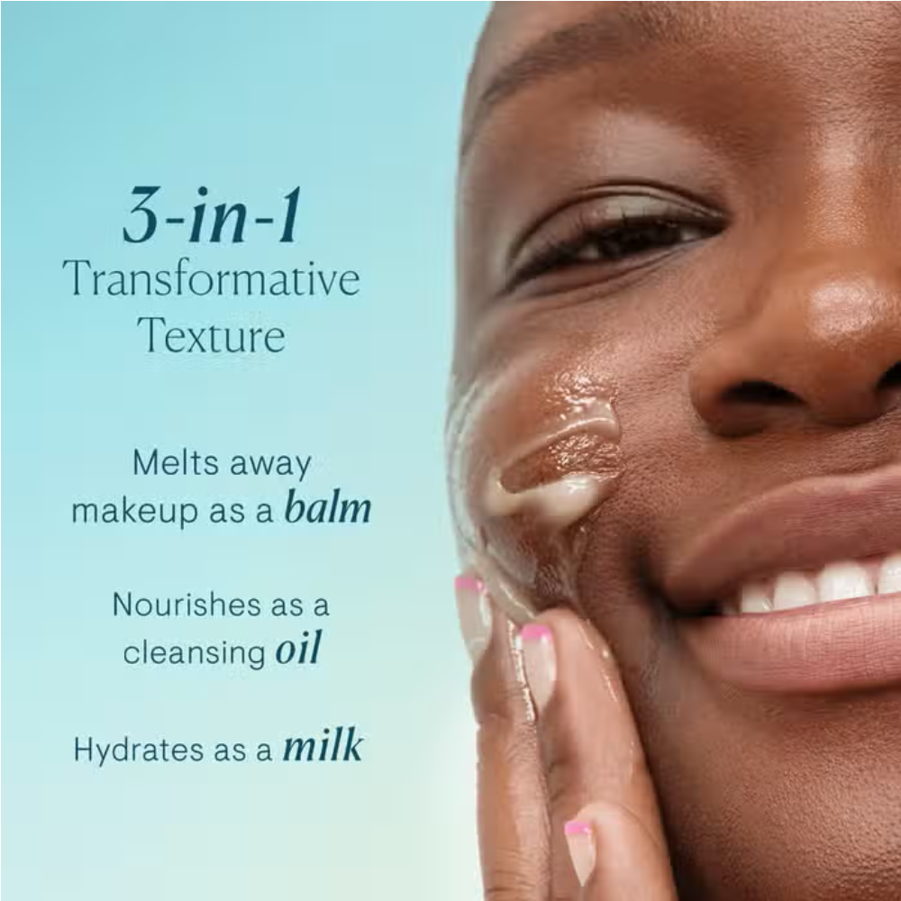 Golden cleansing balm applied to cheek and chin on a smiling face