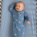 Blue bird-print baby gown with long sleeves, button placket, and knotted bottom