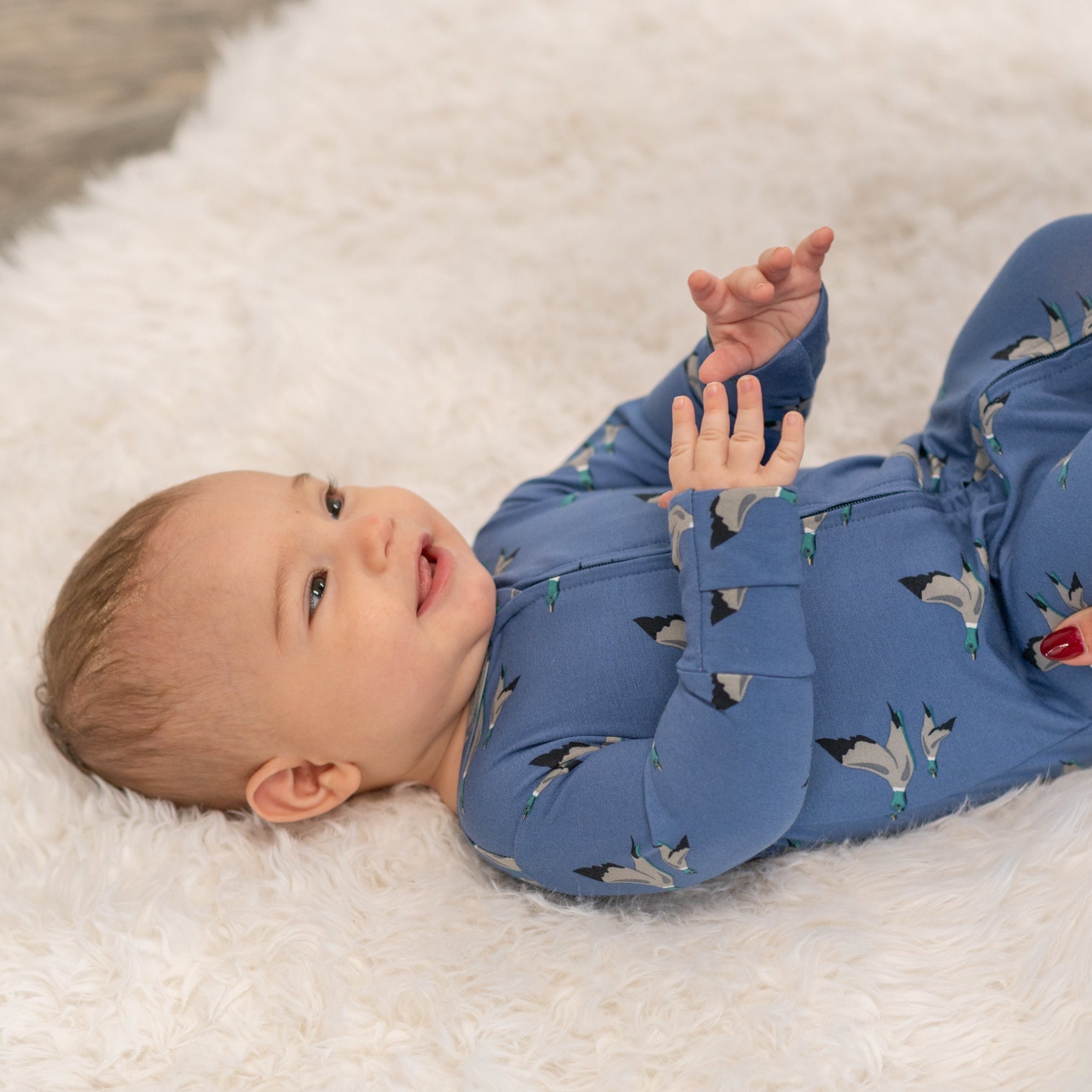 Blue bird-print zip-front footie with long sleeves and footed cuffs