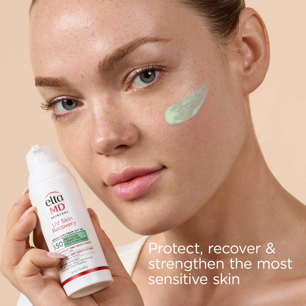 EltaMD UV Skin Recovery SPF 50 sunscreen on face with green tint, holding bottle