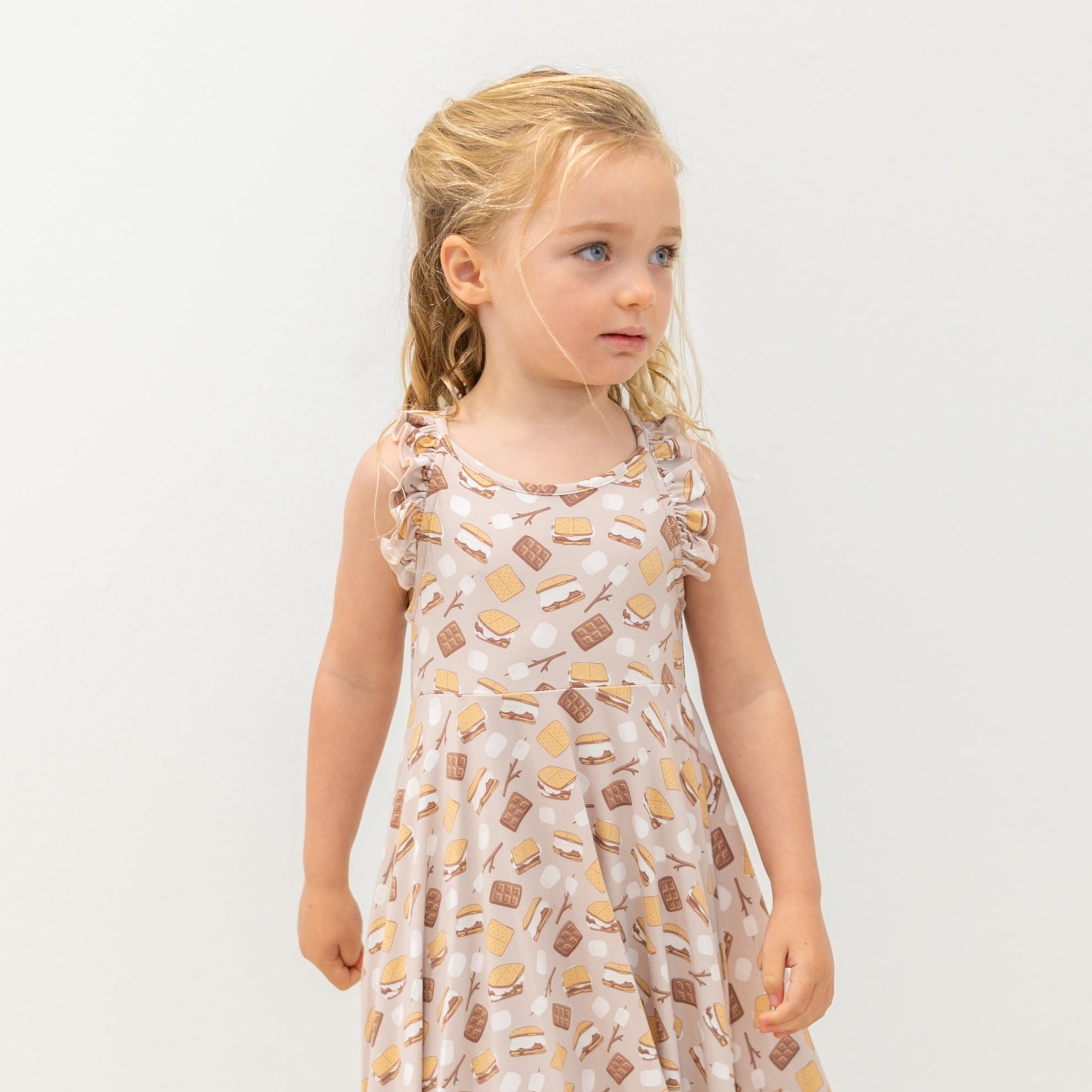 Girls racerback dress in light pink with allover snack print, ruffled sleeves