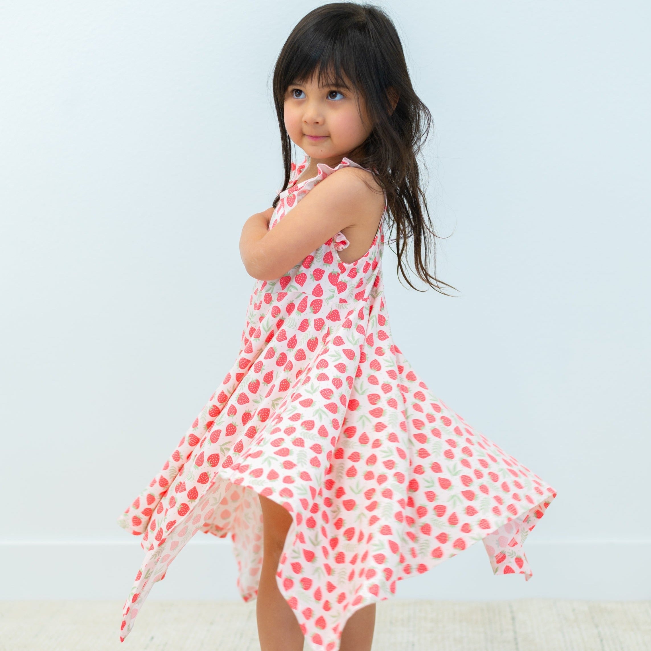 Girl's racerback dress with pink strawberry pattern, flared skirt