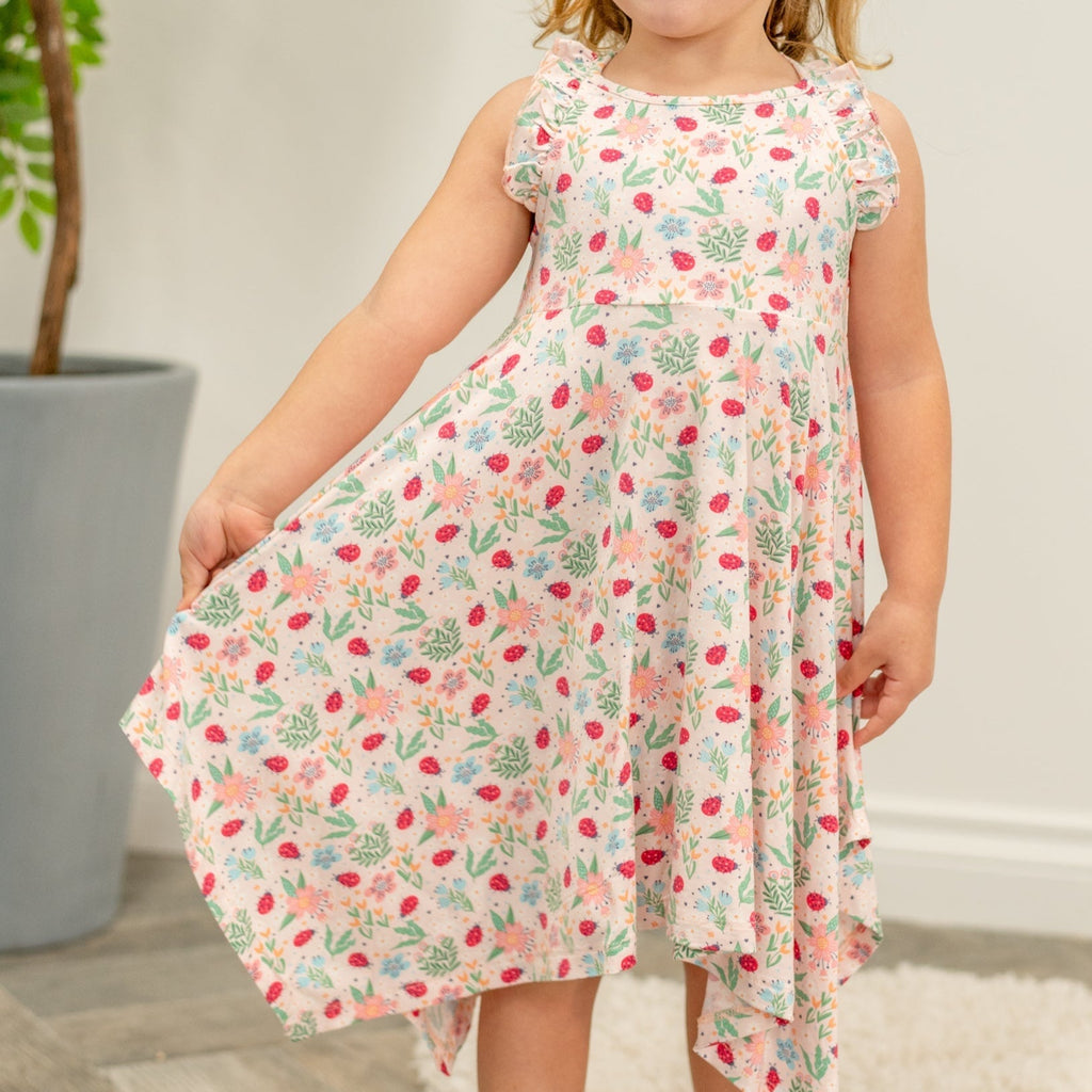 Girls’ racerback dress with playful ladybug and garden print; tiered, swingy hem