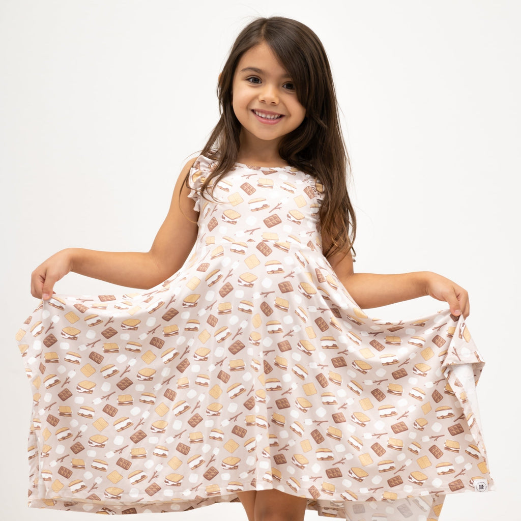 Girls racerback dress with snack print, flared skirt and ruffled shoulder details