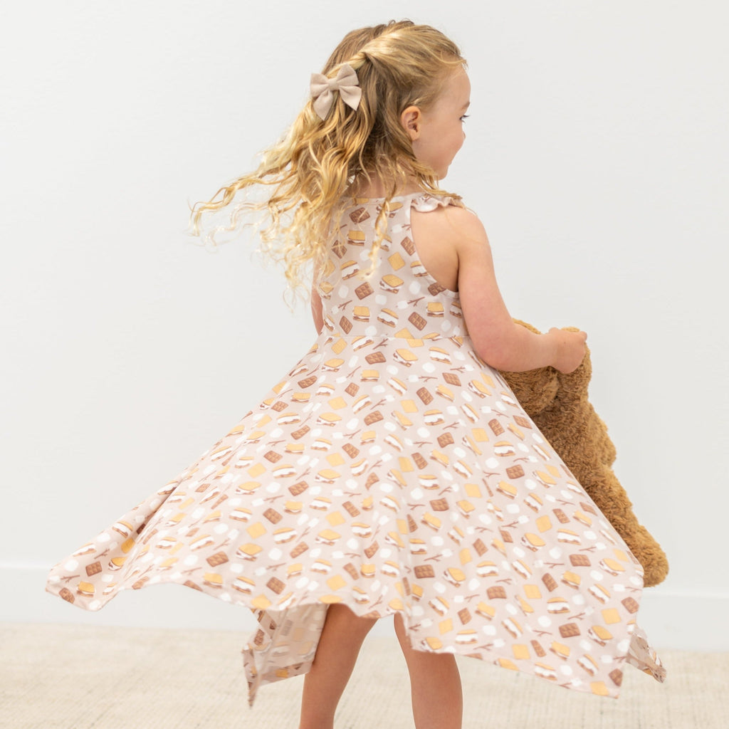 Girls racerback dress with snack print, open back view and swingy asymmetrical hem