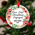 Personalized round engagement Christmas ornament with floral wreath and names Luke+Sara, 2021