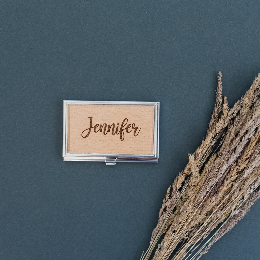 Engraved card holder with “Jennifer” script inside a silver frame