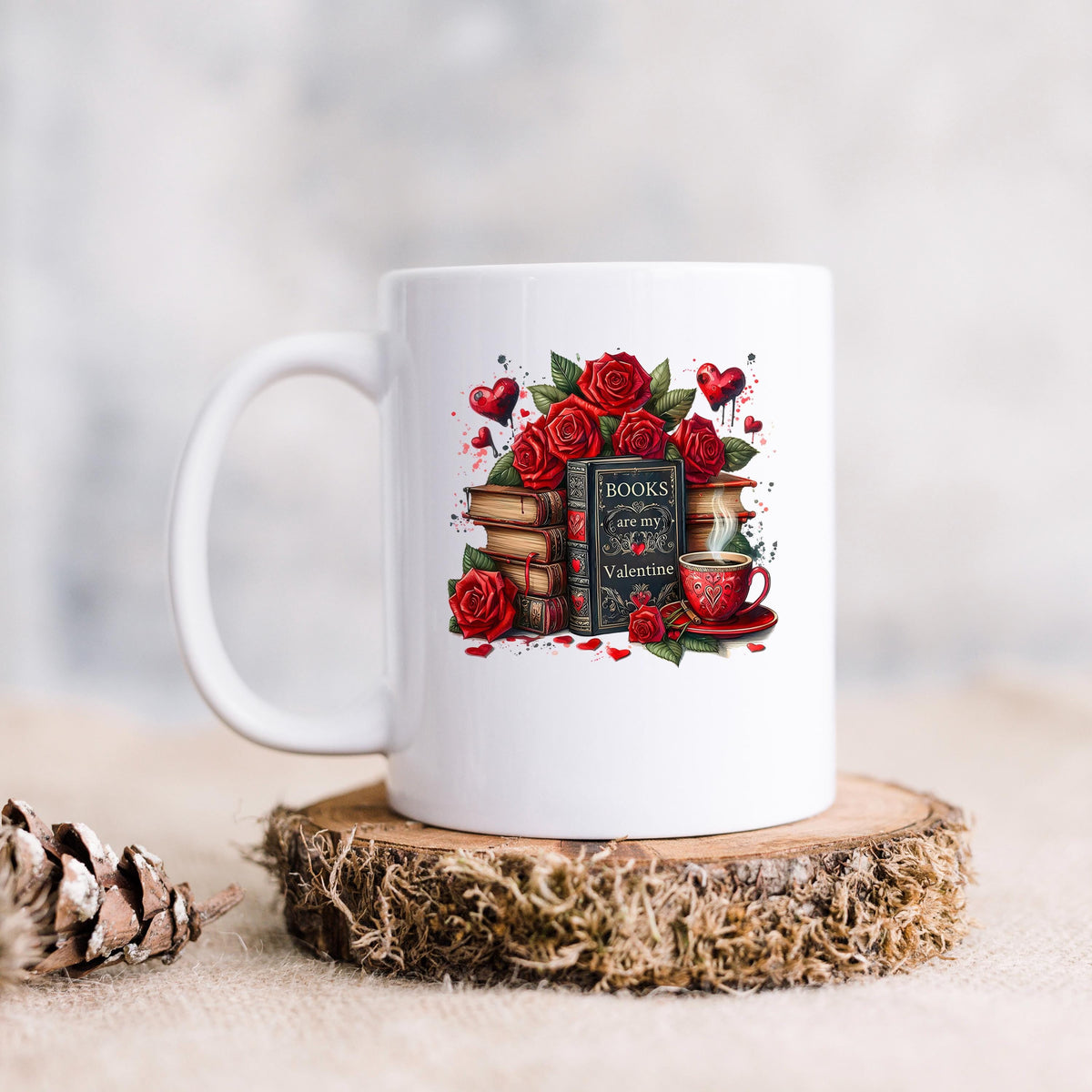 White ceramic mug with red roses, stacked books, and Valentine teacup graphic.