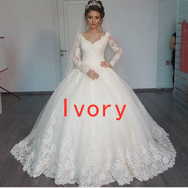 Ivory women's lace wedding dress with long sleeves, V-neck bodice, and full skirt