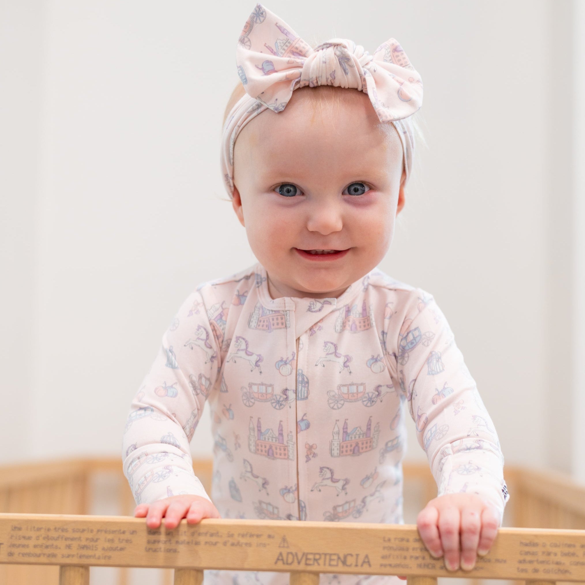 Baby convertible romper, light fabric with pastel icon print, long sleeves, front zipper