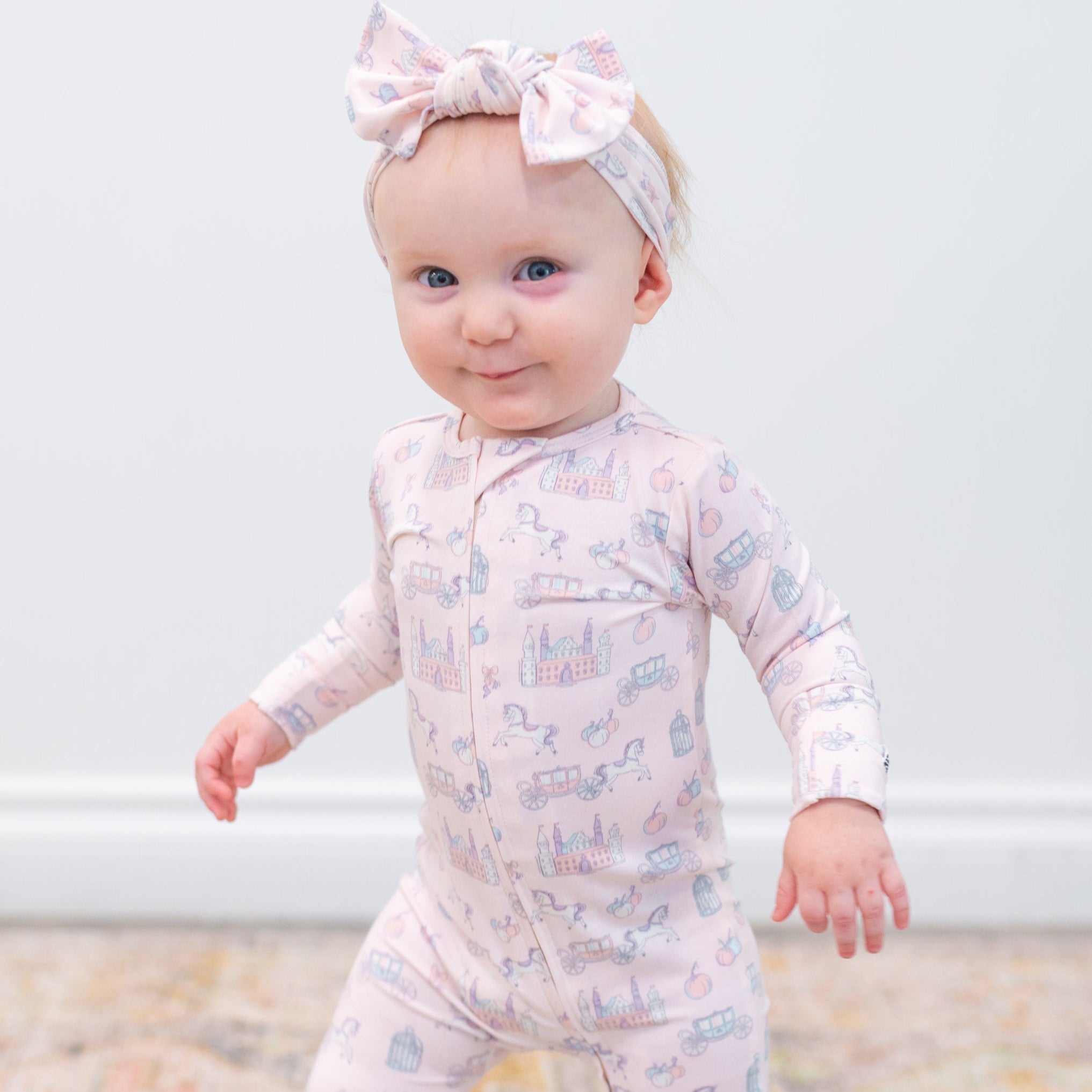 Baby convertible romper, light fabric with pastel icon print, long sleeves, front zipper