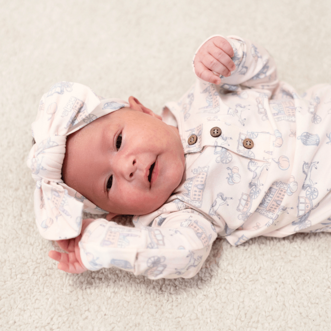 Knotted baby gown with all-over cartoon print, button-front, long sleeves