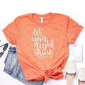 Faith Christian T-shirt in coral orange with white 'Let your light shine' text
