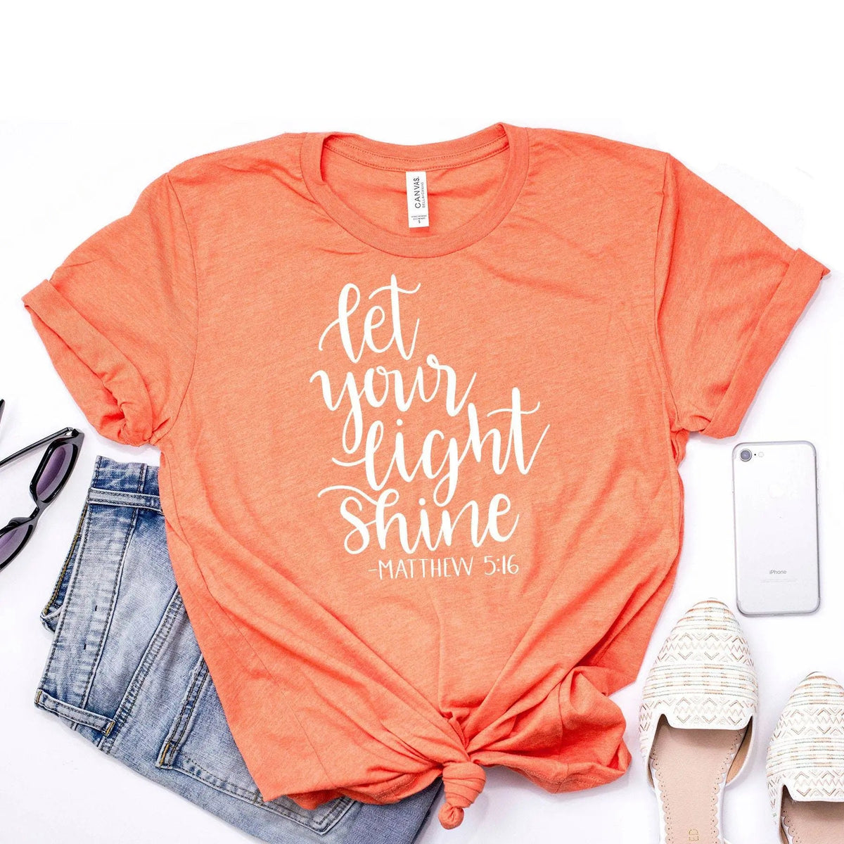 Faith Christian T-shirt in coral orange with white 'Let your light shine' text