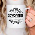 White ceramic mug with black coworker humor text graphic on the front