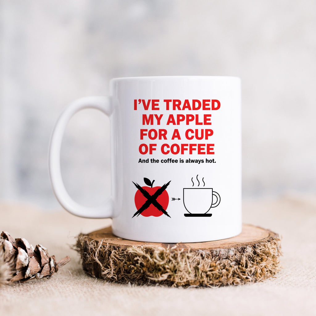 White ceramic mug with red 'I've traded my apple for a cup of coffee' text and cup icon
