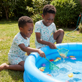 Boy wearing light blue fishing-print pajama shirt and shorts, matching set