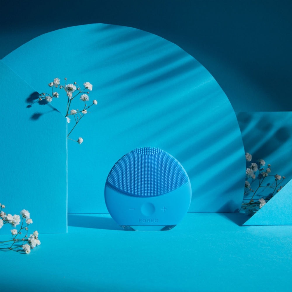 Aquamarine silicone facial cleansing brush with domed textured head