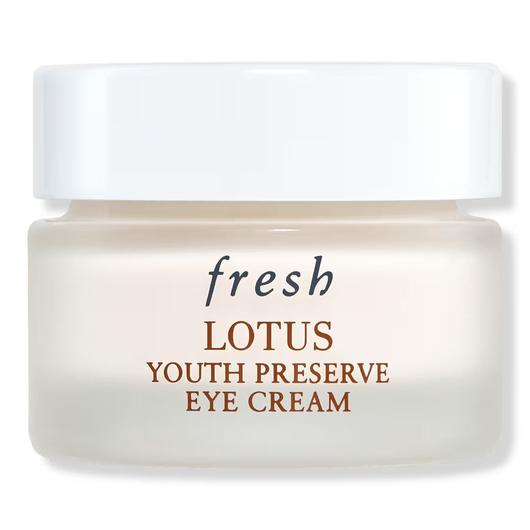 Eye cream jar with Fresh Lotus Youth Preserve label, white and beige container