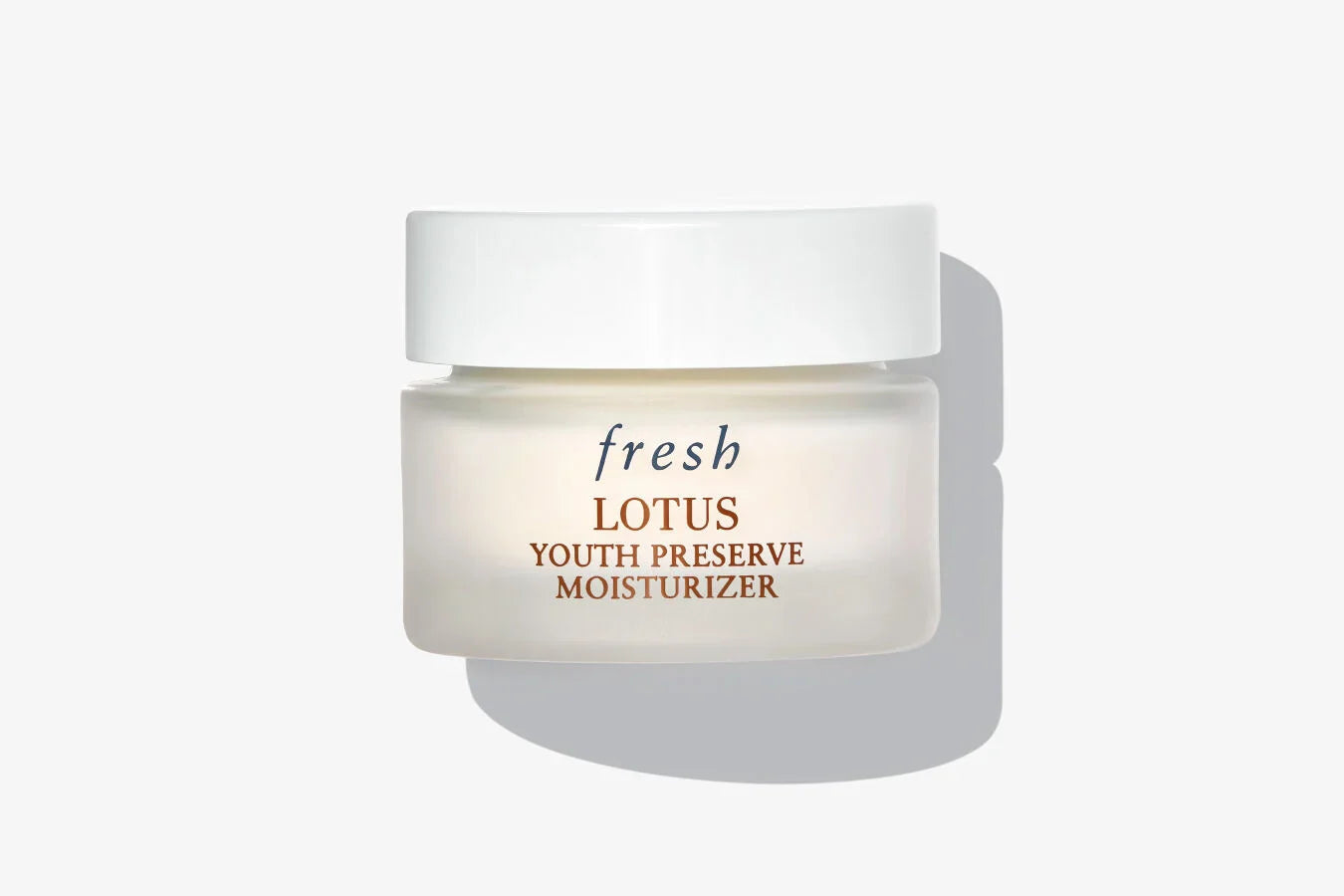 Fresh Lotus youth day cream jar, white screw-top lid, cream moisturizer in jar