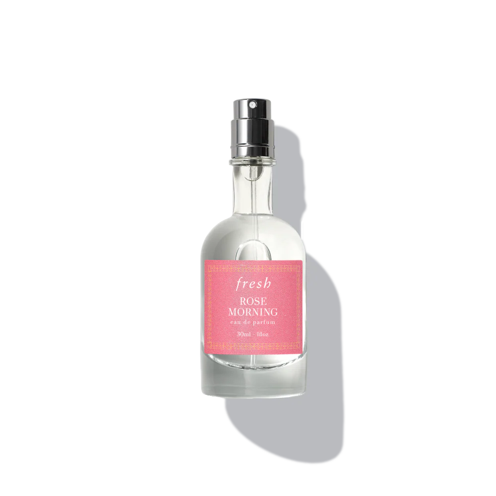 Eau de parfum bottle with clear glass, silver sprayer, pink label