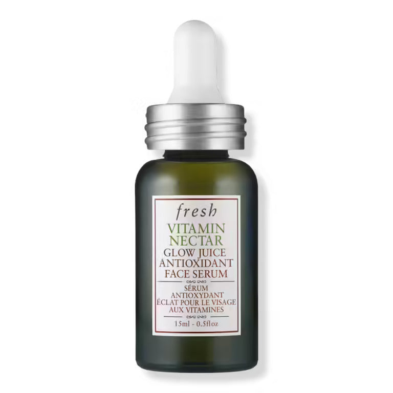 Fresh vitamin face serum bottle, dark glass with silver cap and label