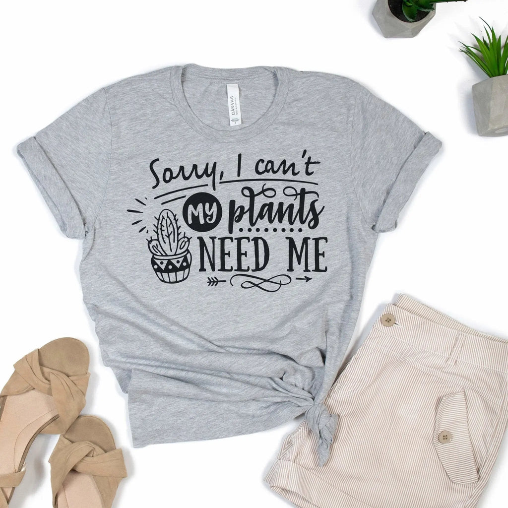 Gray unisex t-shirt with “Sorry, I can't live without my plants” graphic