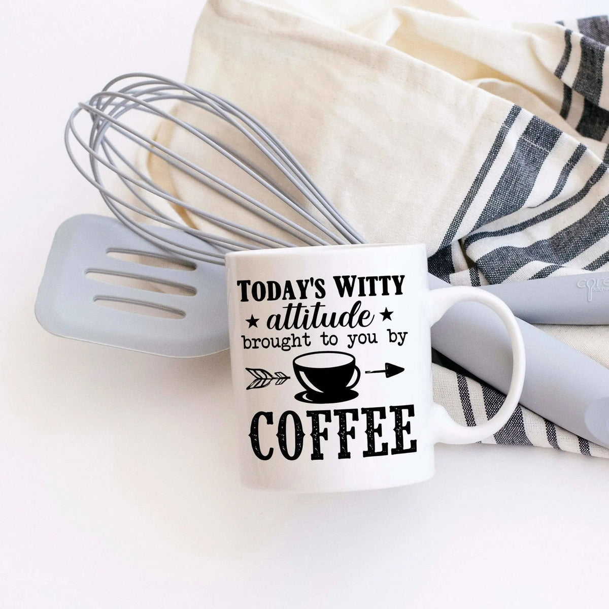 White coffee mug with 'Today’s Witty Attitude' and 'COFFEE' print, side view