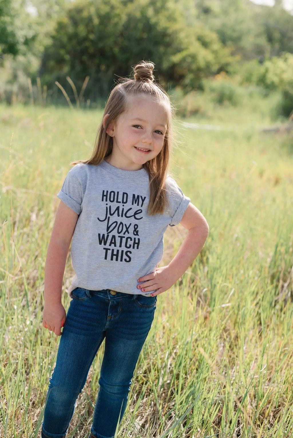 Gray toddler T-shirt with black "Hold my juice box and watch this" text front