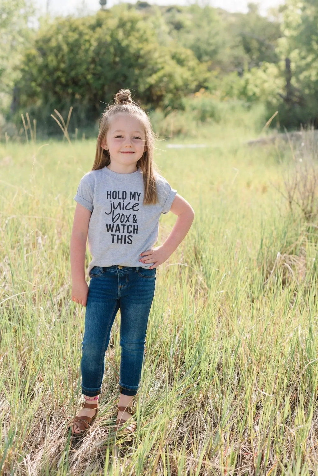 Gray toddler T-shirt with black "Hold my juice box and watch this" quote, full front