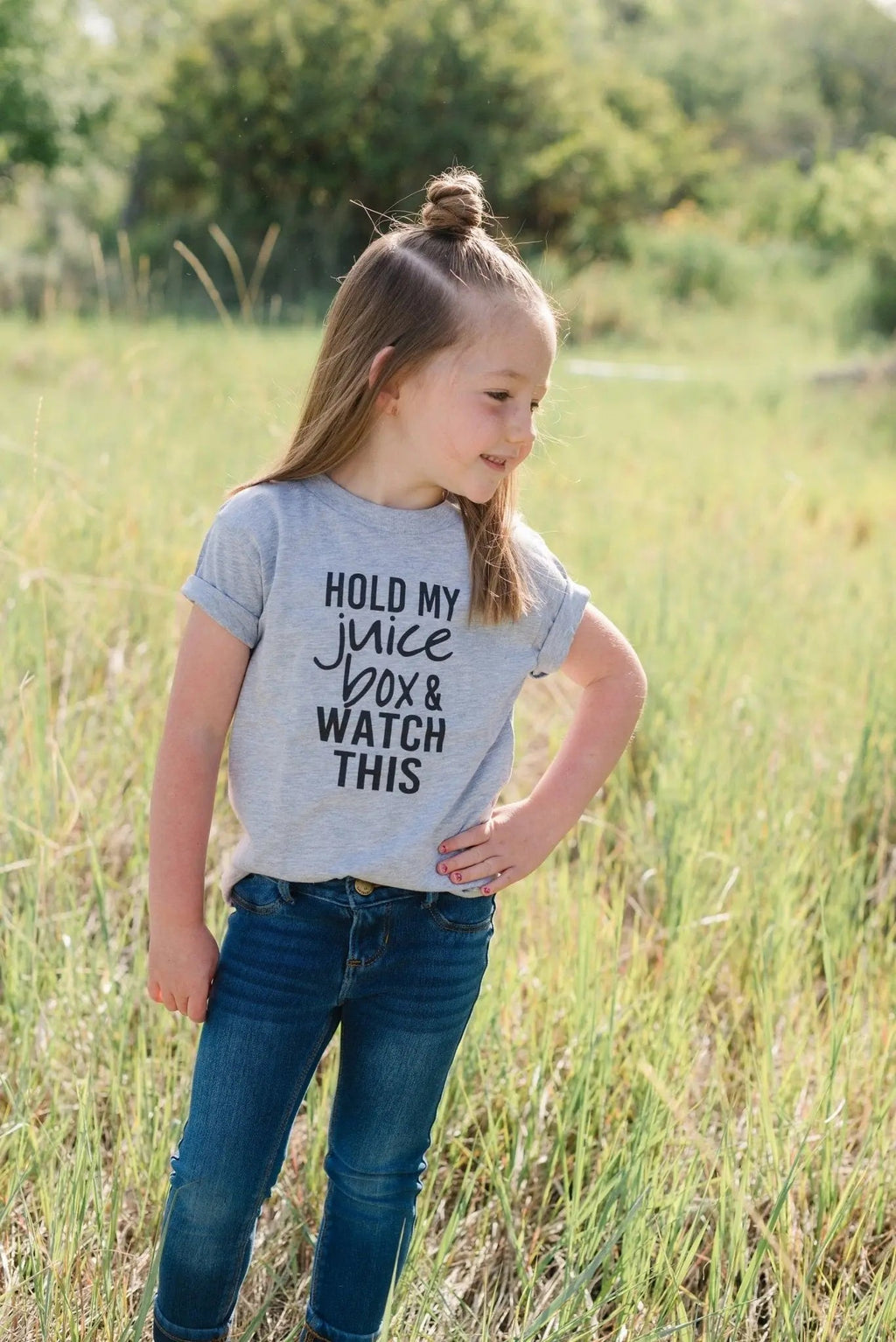 Gray toddler T-shirt showing "Hold my juice box and watch this" quote text