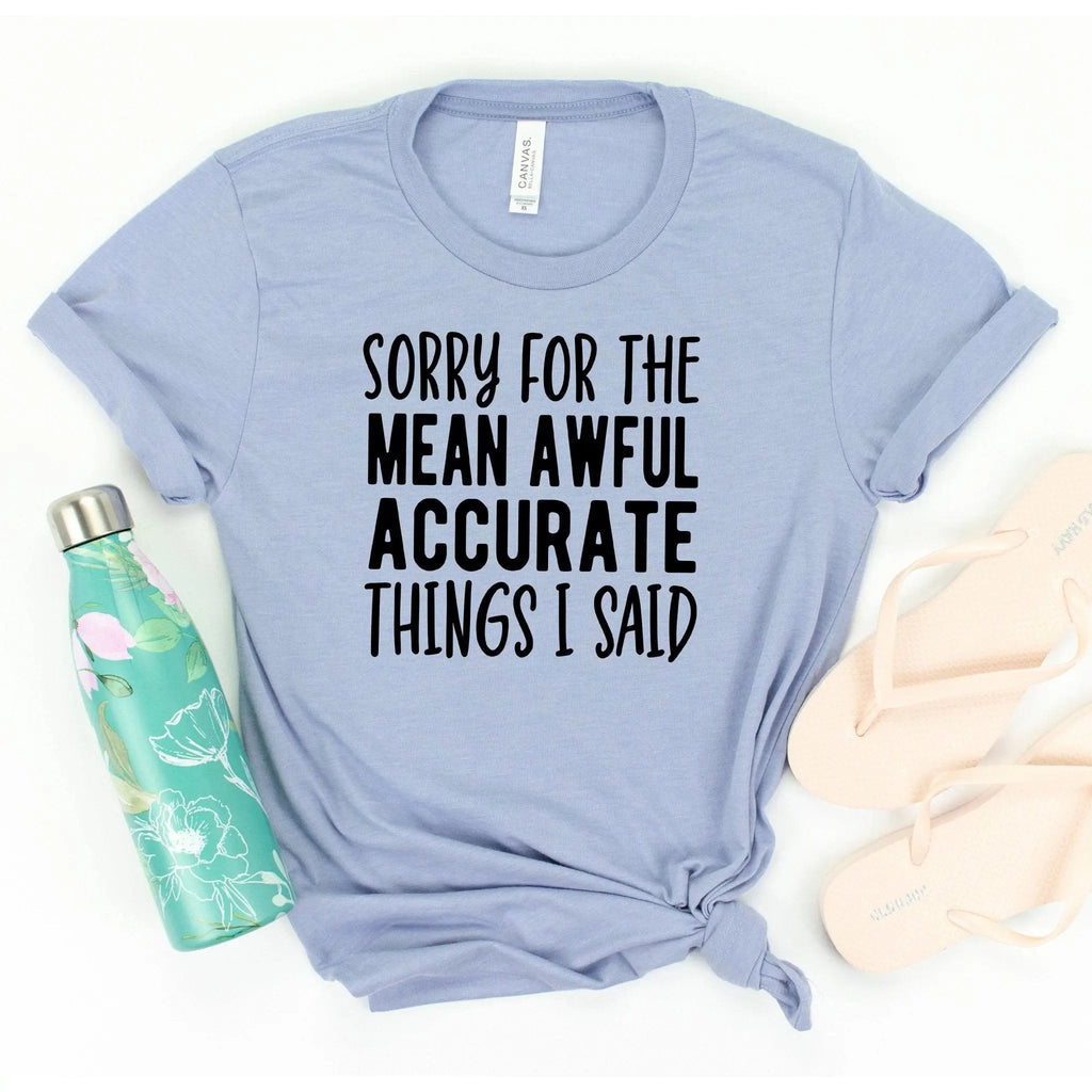 Blue unisex T-shirt with black quote graphic: “Sorry for the mean awful things I said”