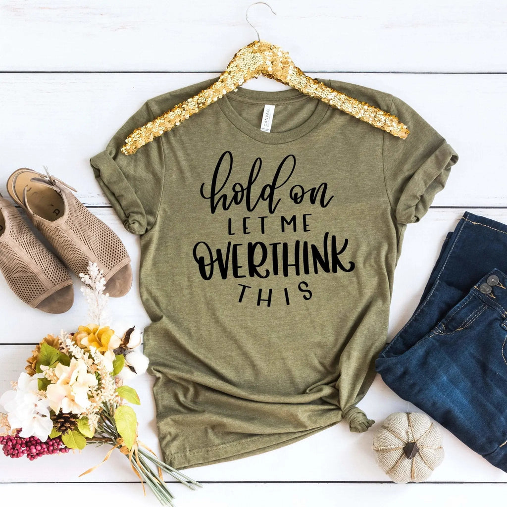 Olive womens T-shirt with “hold on let me overthink this” graphic text