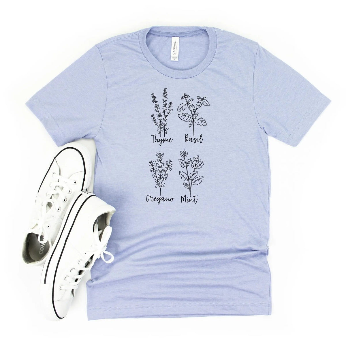 Light blue unisex T-shirt with botanical herb names and leaf illustration, crew neck