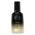 Oribe Balm d'Or Heat Styling Shield bottle with black cap and amber liquid