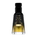 Oribe Gold Lust all over oil bottle with black cap, golden liquid