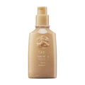 Oribe Matte Waves texture lotion bottle, beige pump dispenser