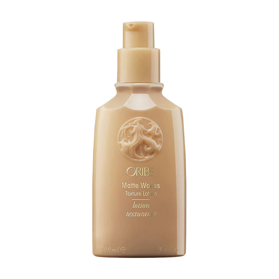 Oribe Matte Waves texture lotion bottle, beige pump dispenser