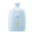 Oribe Run-Through Detangling Shampoo bottle, light blue, front label