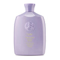 Oribe Serene Scalp Oil Control Shampoo bottle, purple translucent plastic.