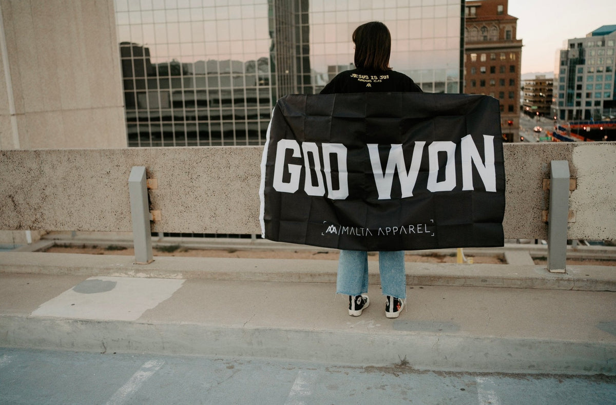Black hoodie with large back print 'GOD WON' and Malta Apparel logo