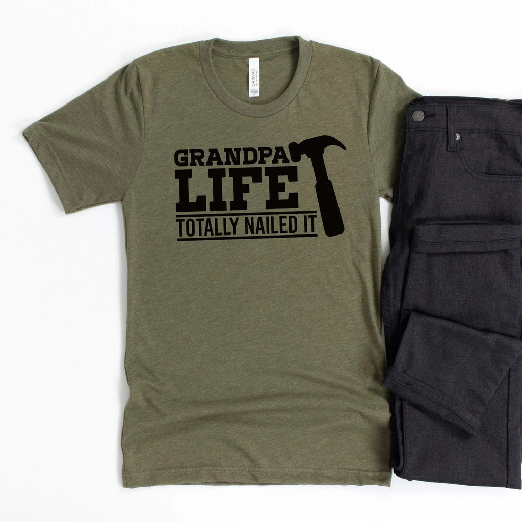 Olive unisex T-shirt with "GRANDPA LIFE" and "TOTALLY NAILED IT" graphic print