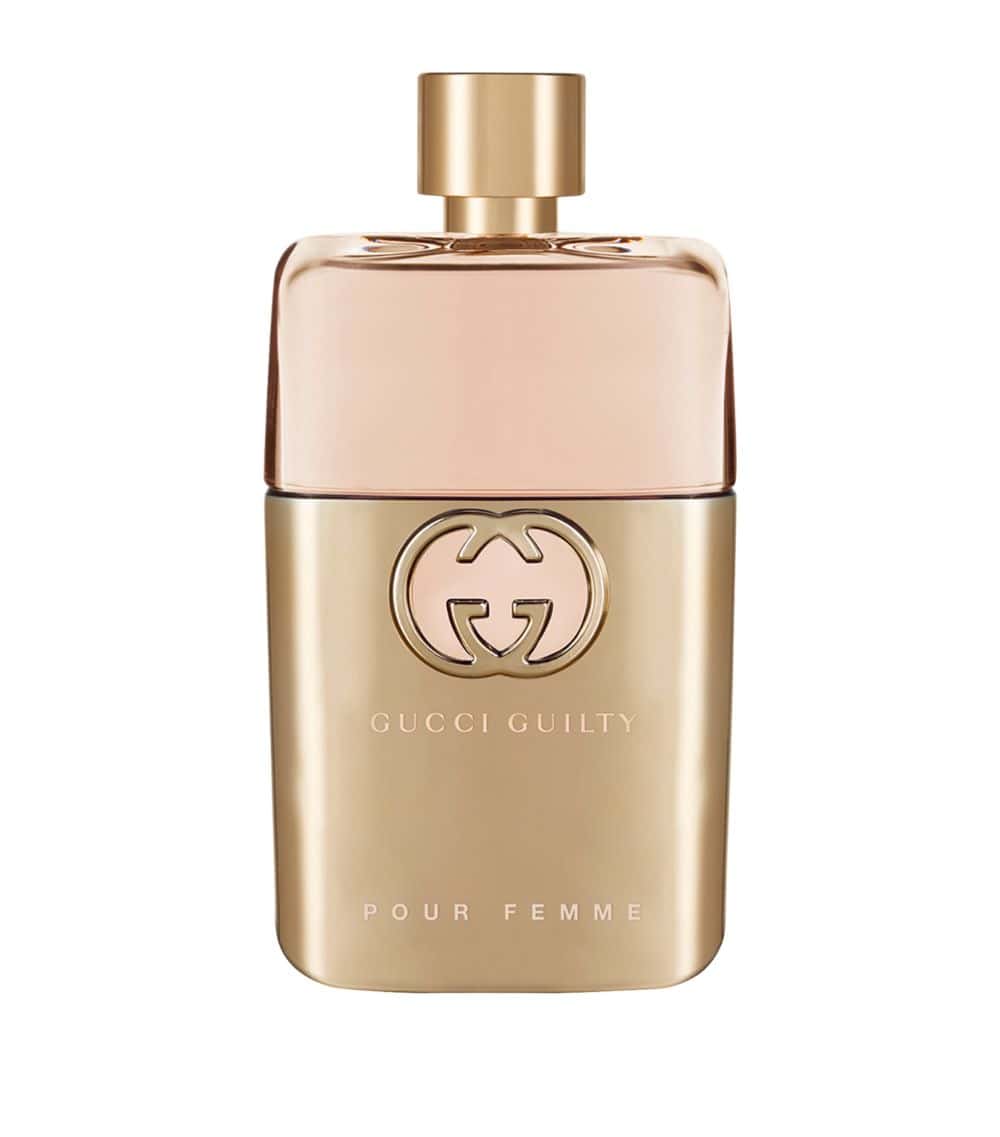 Eau de parfum bottle with gold cap, Gucci Guilty logo and Pour Femme label