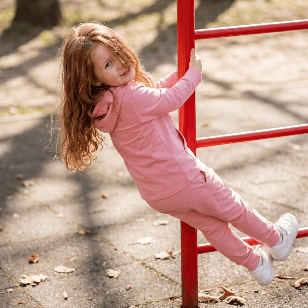 Carnation pink hooded jogger set on child: pink hoodie and matching jogger pants