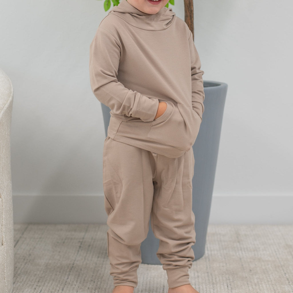 Taupe hooded jogger set on child, long-sleeve top and tapered cuffed joggers