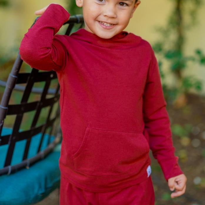 Rhubarb red hooded pullover on child with matching jogger pants, full outfit