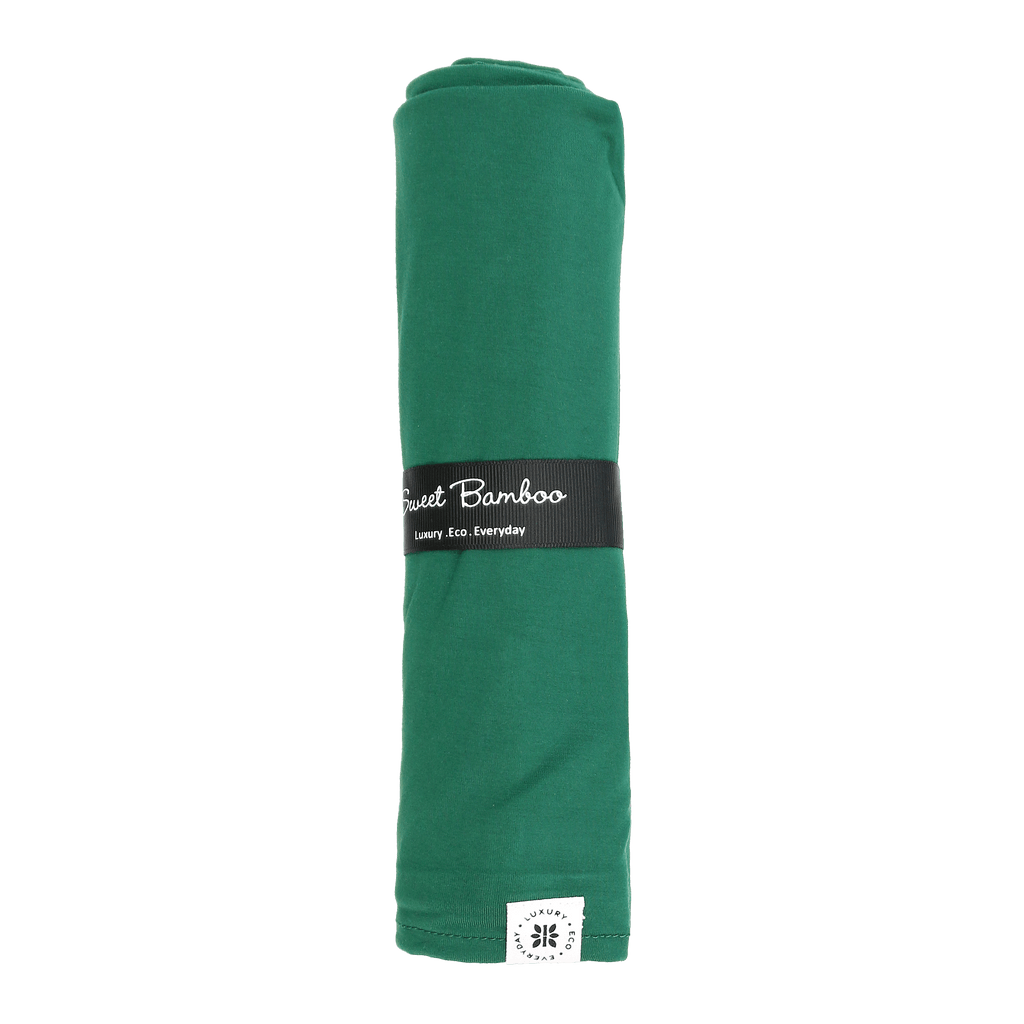 Hunter green Sweet Bamboo swaddle blanket, folded with branded band and corner logo