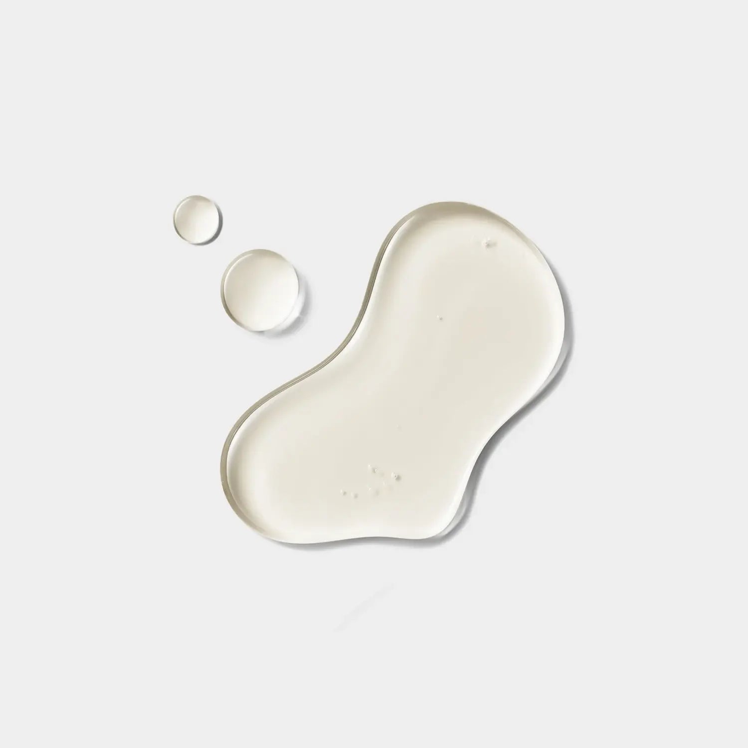 Serum texture smear in pale cream with two small dots