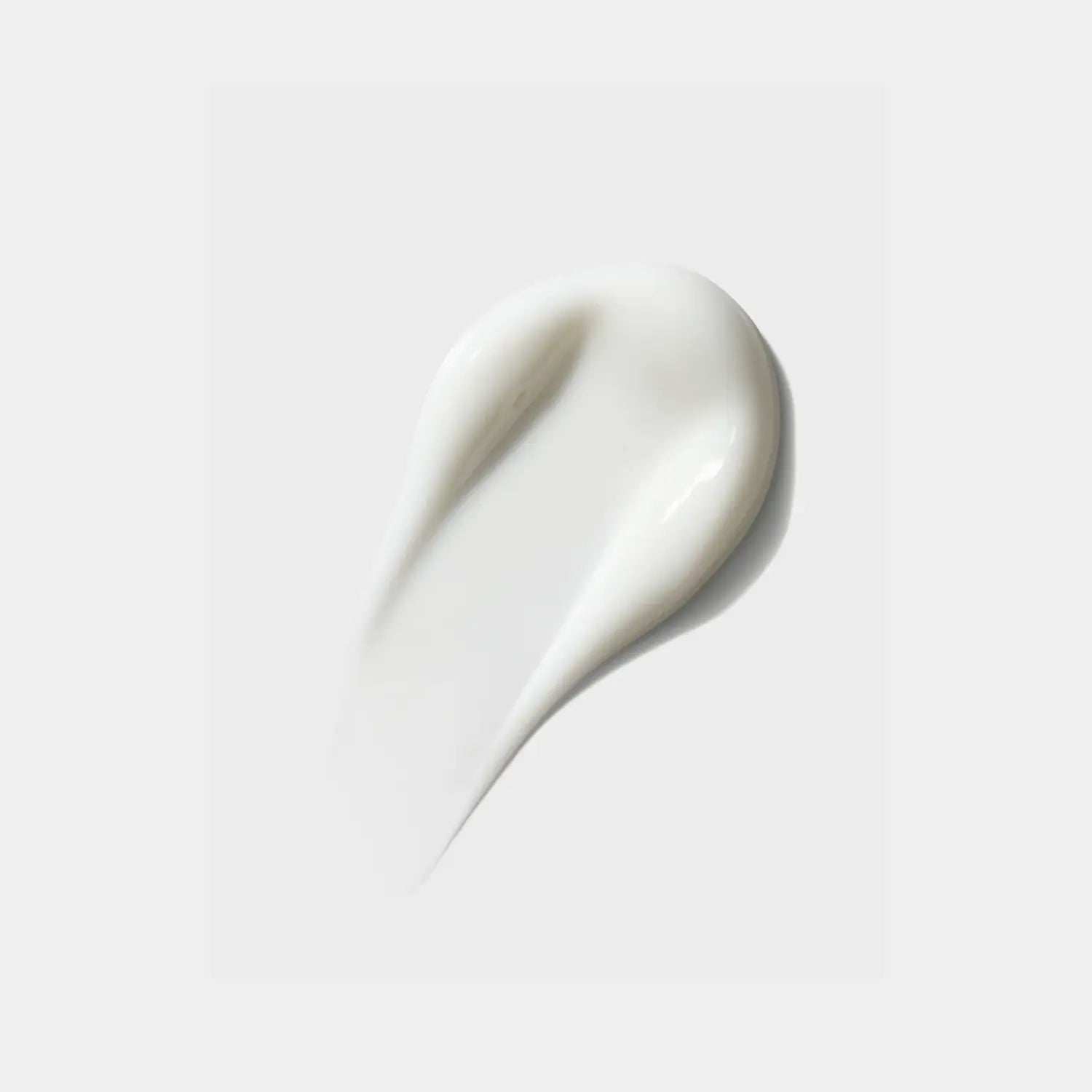 iS Clinical Moisturizing Complex cream swatch, glossy white dollop