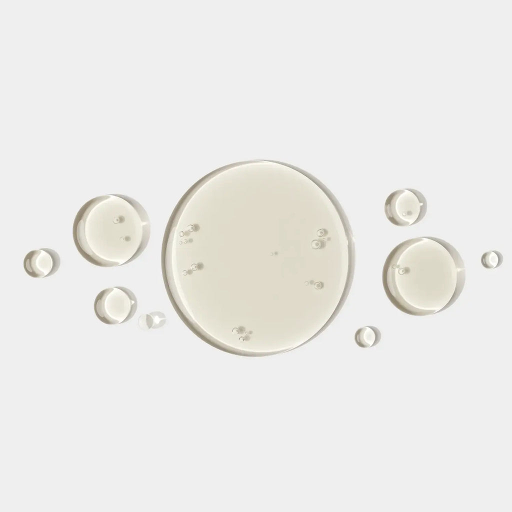 iS Clinical PRO-HEAL serum bottle parts: amber bottle with white cap and small pieces